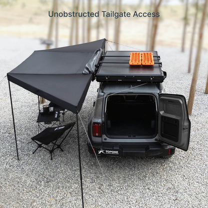 TOPOAK 180 degree car awning on SUV allowing full tailgate access with rear door open during camping setup