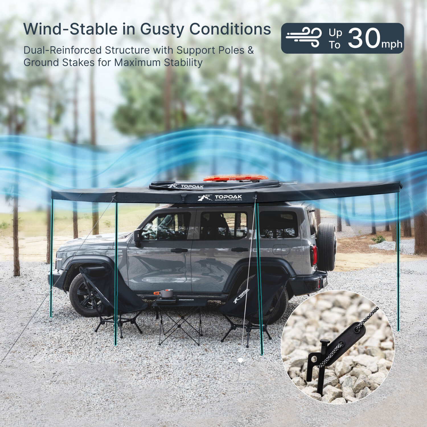 TOPOAK 180 degree car awning set up on SUV with support poles and ground stakes demonstrating wind stable design for camping use