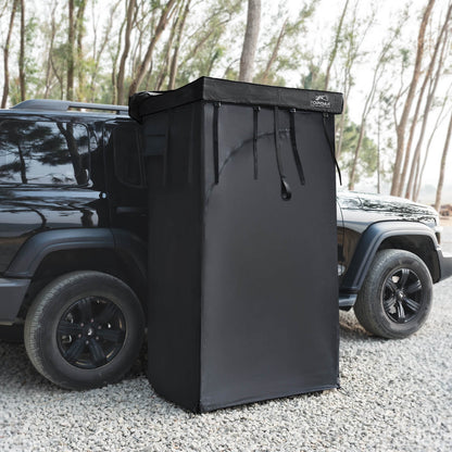 Vehicle mounted awning shower room privacy tent attached to an SUV for overland camping