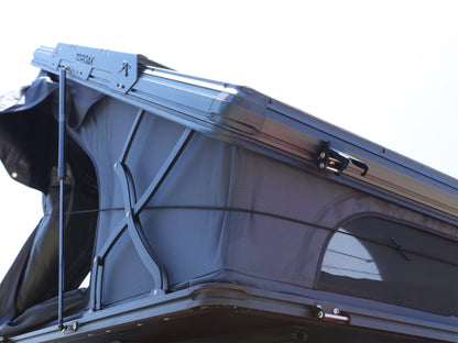 Front view of TOPOAK Nebula rooftop tent opened, showing its 10-inch closed height and sturdy structural frame for full extension and comfort.