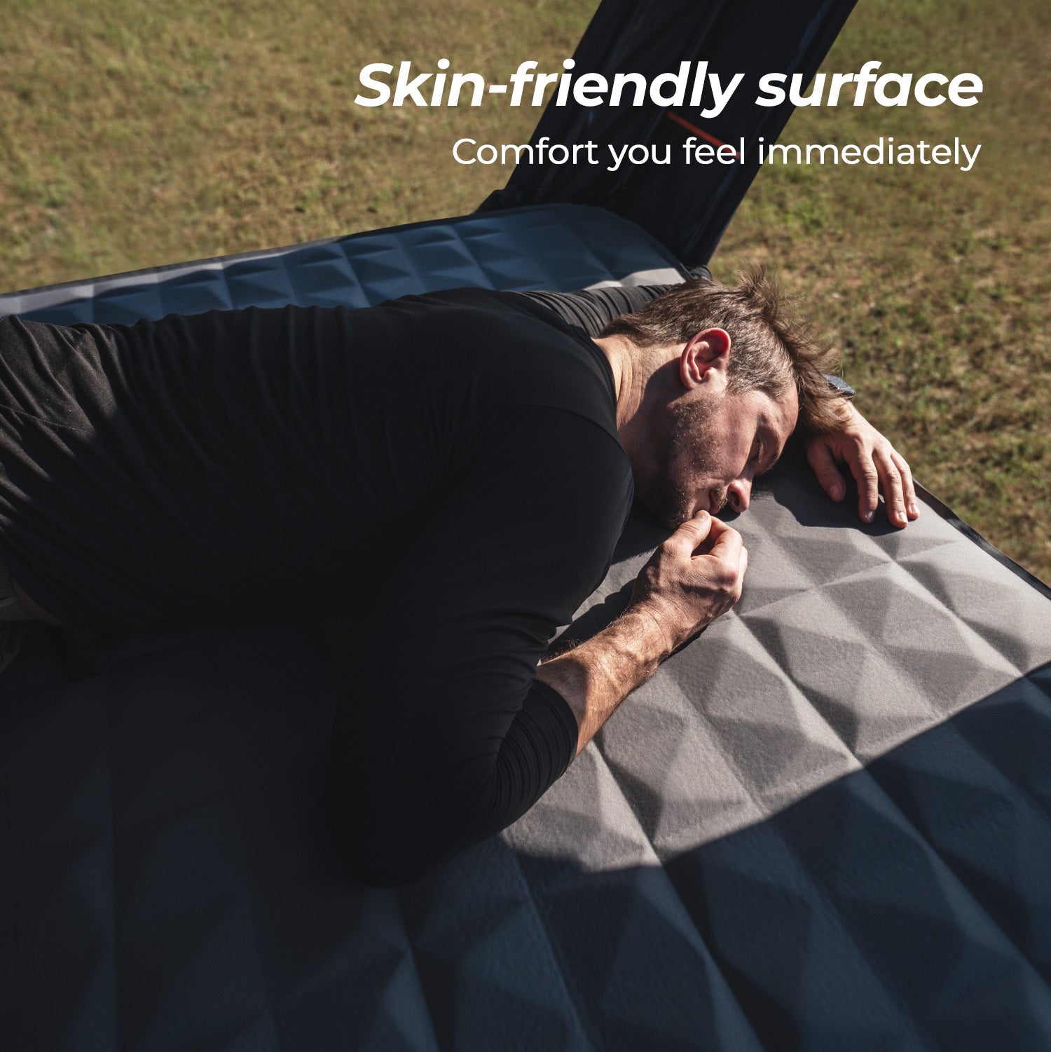 Inflatable mattress inside a rooftop tent showing a soft, quilted, skin-friendly sleeping surface.