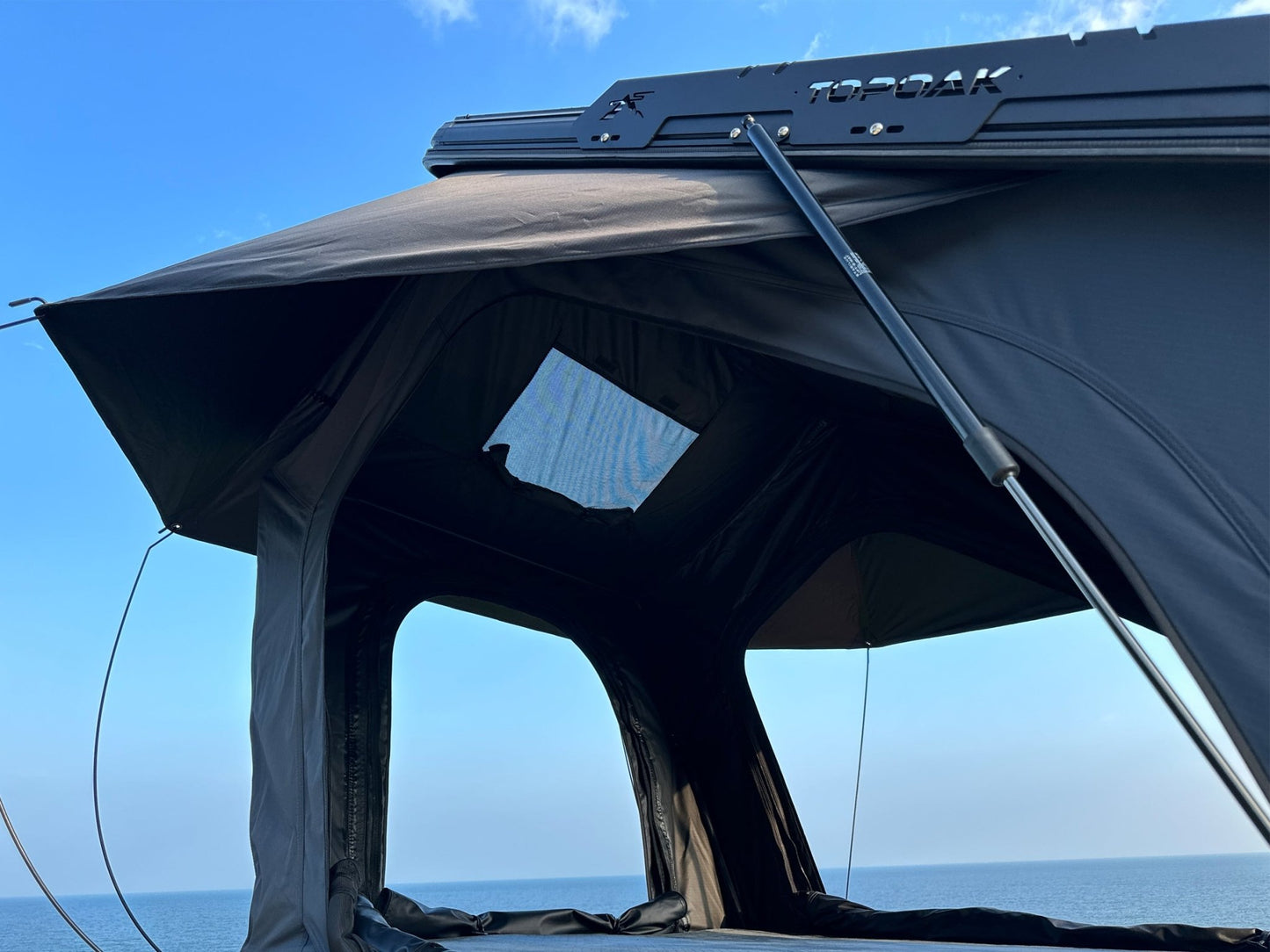 Interior view of TOPOAK Nebula rooftop tent featuring 320G gray blackout fabric that is mildew-resistant and UV50 protected for better comfort and durability.