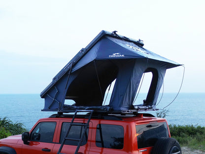 Rear side view TOPOAK Nebula rooftop tent mounted on SUV, hard shell RTT for 4-season camping