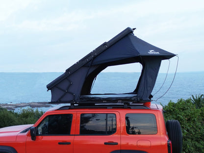 Side view TOPOAK Nebula rooftop tent mounted on SUV, hard shell RTT for 4-season camping