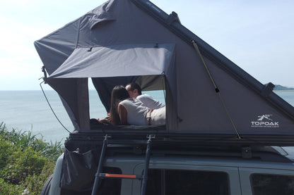 Side view of the TOPOAK Stellar rooftop tent fully opened on a vehicle roof rack