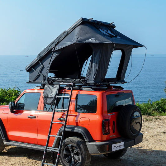 TOPOAK Nebula rooftop tent mounted on SUV, hard shell RTT for 4-season camping.
